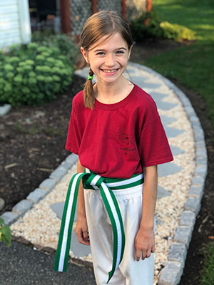 Leah wearing her green belt