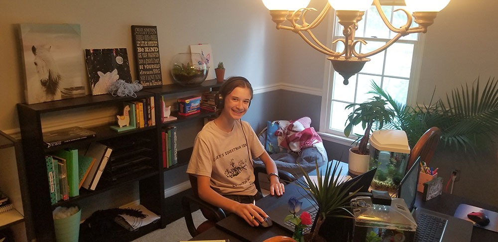 Samy at her desk